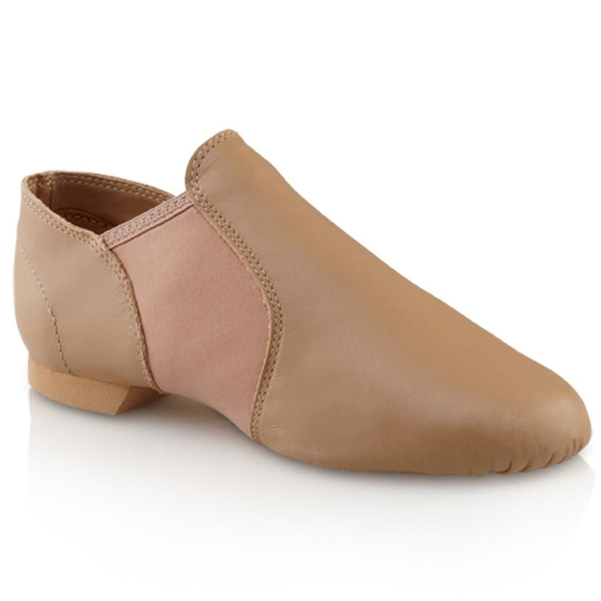 Capezio E‑Series Jazz slip‑on in tan leather showing split‑sole flexibility, elastic insets, cotton lining, and low-profile heel for smooth transitions.