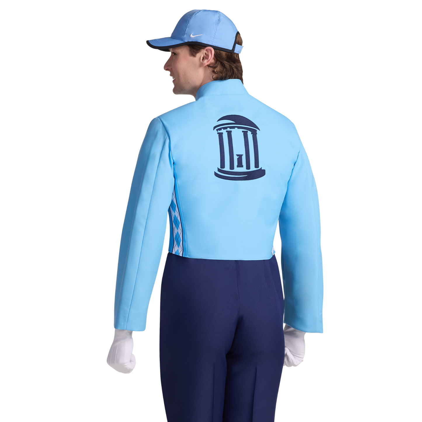 Person wearing a light blue jacket with a logo on the back, dark blue pants, and white gloves on a white background.