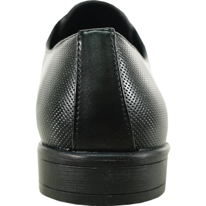 “Heel angle of King 1 Oxford shoe in matte black, showing stacked heel detail, reinforced back seam, and padded collar for support and structure during marching performances