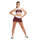 a sleeveless peekaboo sports bra showcasing a stylized wildcat logo on the chest—ideal for color guard, dance, or spirit teams
