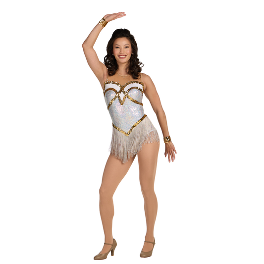 Woman wearing a sparkling white and gold dance costume on a white background