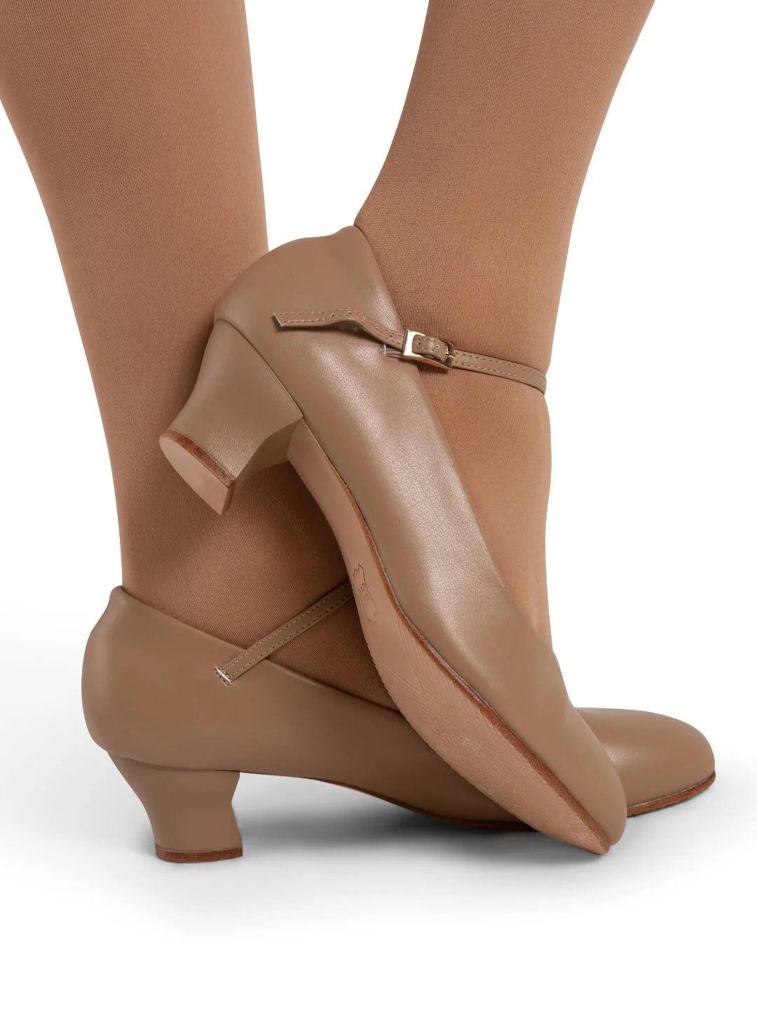 Mia Jr 1.5″ caramel character shoe featuring PU microfiber upper, sculpted heel, adjustable strap, and leather sole shown on model