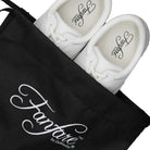 Heel view of white Fanfare shoe showing padded backcounter, reinforced heel seam, latex heel pod, and tapered outsole for stability and ankle support during marching