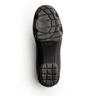 Sole view of Dinkles Accent guard shoe showing full rubber PU sole pads with sewn split‑sole pattern, circular pivot zone, and deep traction grooves for indoor/outdoor use