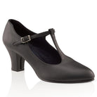 Pair of Jr. Footlight T‑Strap shoes in black and caramel, featuring tapered toe box, closed sides, and non‑slip heel with leather top lift for stability.